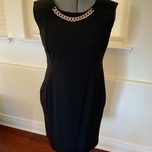 Calvin Klein Black sheath dress with gold chain detail. Size 12.